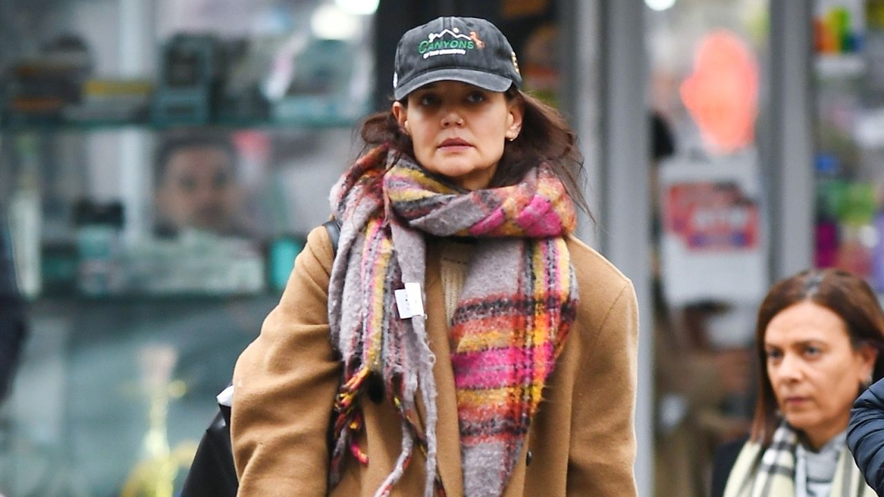 Katie Holmes in a Camel Coat, colorful plaid scarf, jeans