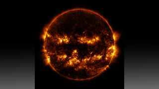 Active regions of the sun create a jack-o-lantern like pattern.