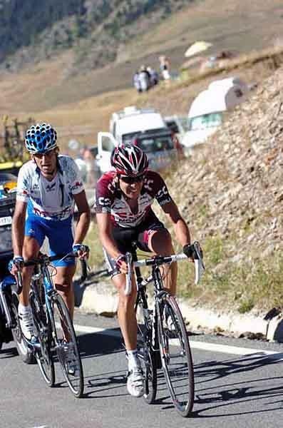 Carlos Sastre, as always not far behind the action.