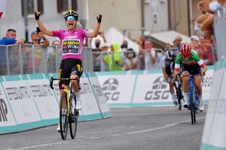 PUEGNAGO DEL GARDA ITALY JULY 08 Marianne Vos of Netherlands and Jumbo Visma Team Purple Points Jersey stage winner celebrates at arrival Elisa Longo Borghini of Italy and Team Trek Segafredo Anna Van Der Breggen of Netherlands and Team SD Worx Pink Leader Jersey during the 32nd Giro dItalia Internazionale Femminile 2021 Stage 7 a 1096km stage from Soprazocco di Gavardo to Puegnago Del Garda 219m GiroDonne UCIWWT on July 08 2021 in Puegnago del Garda Italy Photo by Luc ClaessenGetty Images