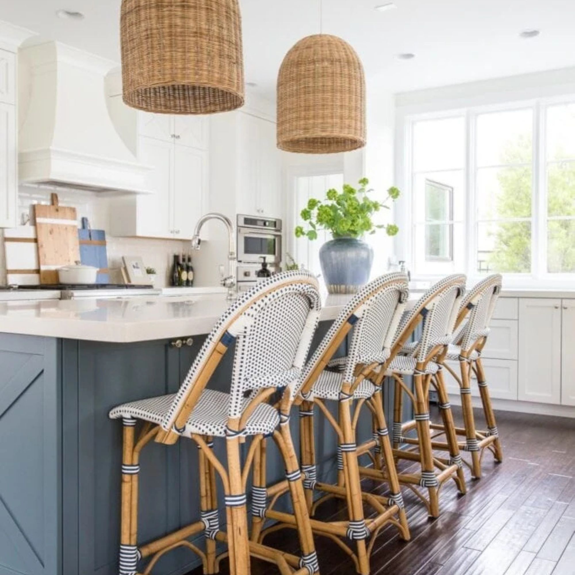 Riviera Rattan Bar & Counter Stools against a white and blue kitchen counter. 