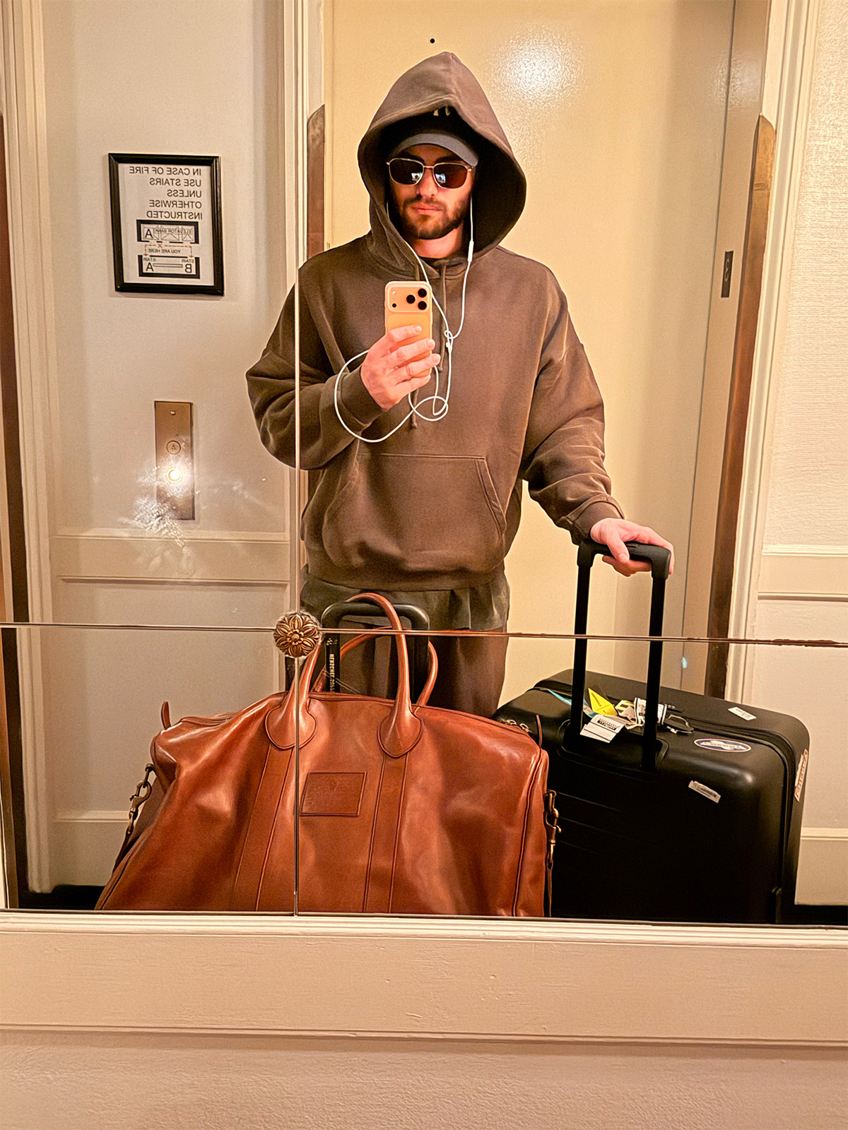 Selfie of Chase Stokes on his way to the airport wearing a matching sweatsuit.
