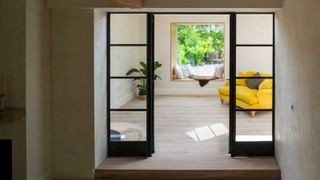 glazed internal doors leading to room with picture window