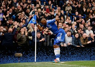 Samuel Eto'o celebrates by mimicking the stance of an old man after scoring for Chelsea against Tottenham in 2014.