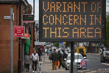 Sign saying variant of concern in this area as local lockdowns are imposed in the UK