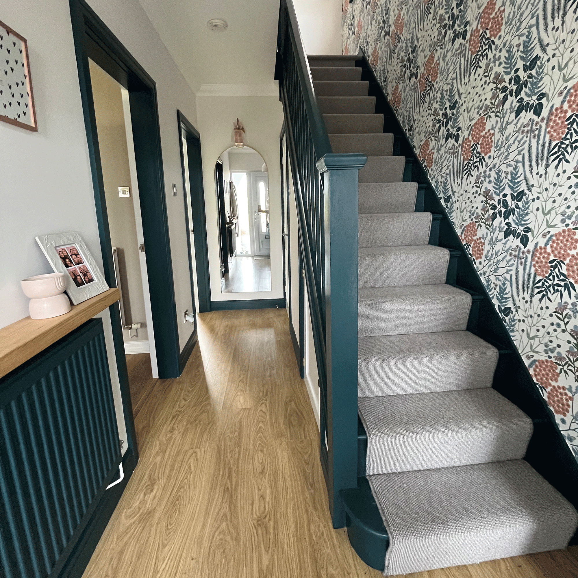 Grey stairs with botanical print wallpaper