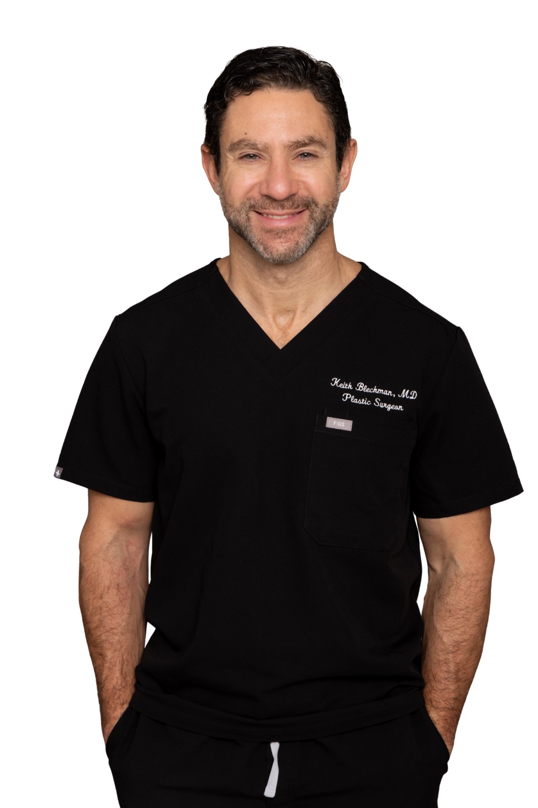 a white man in navy scrubs