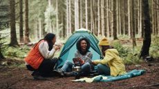 A group of women camping in the woods