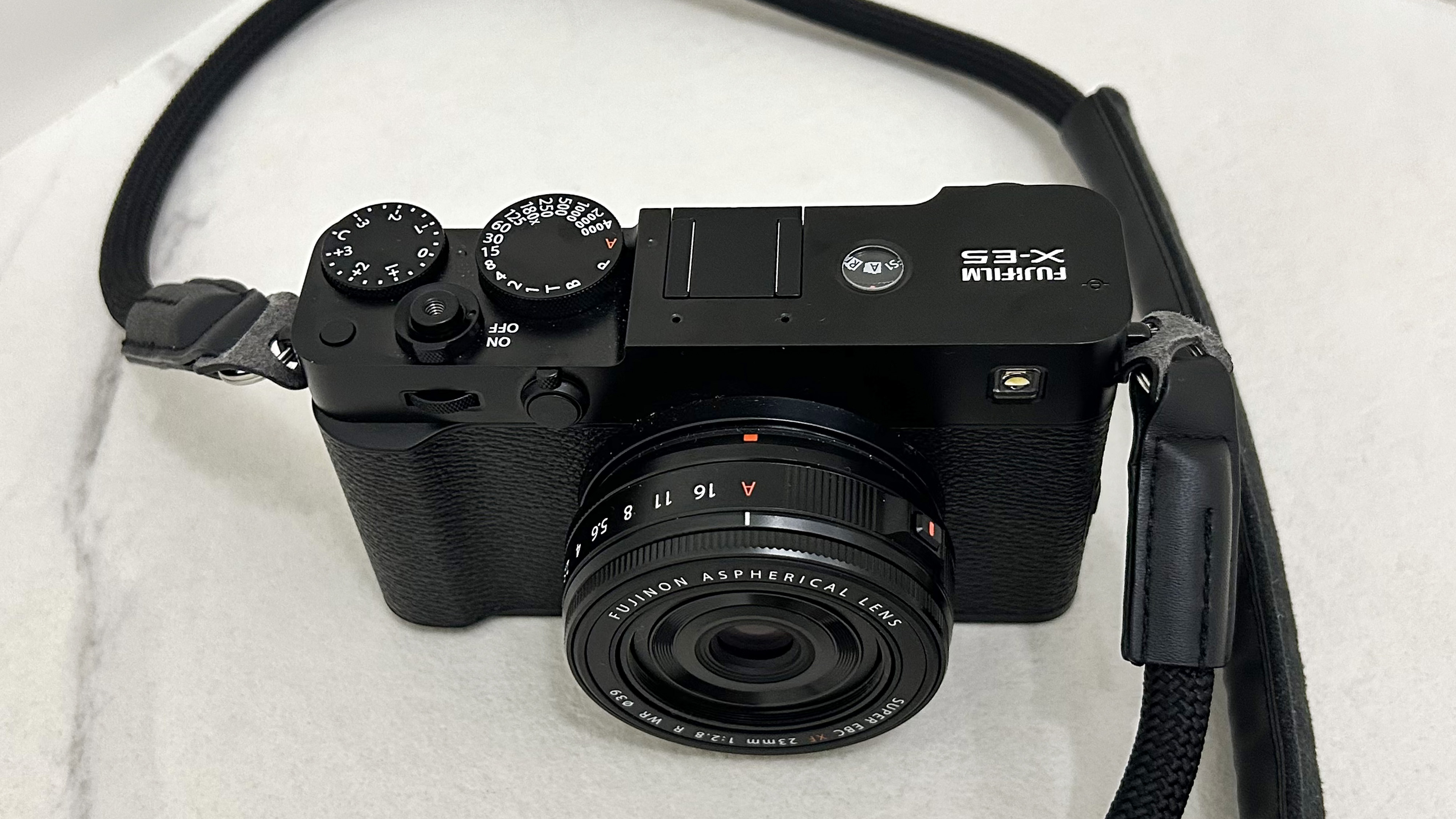 The new Fujifilm X-E5 film simulation camera photographed in front of a white background.