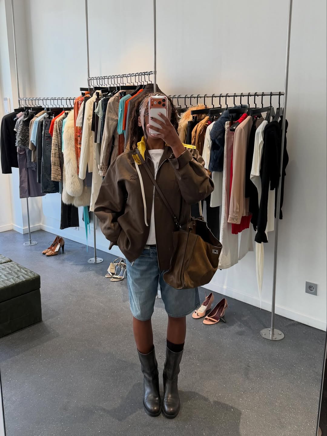 woman wearing bermuda shorts with boots outfit 2025