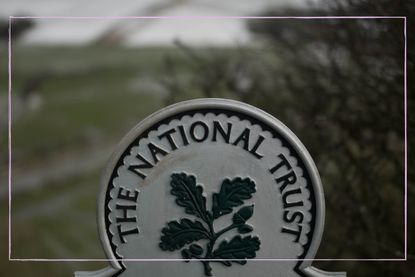 National Trust sign overlooking the countryside.
