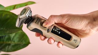 Person turning on the Philips Shaver S9000 Prestige