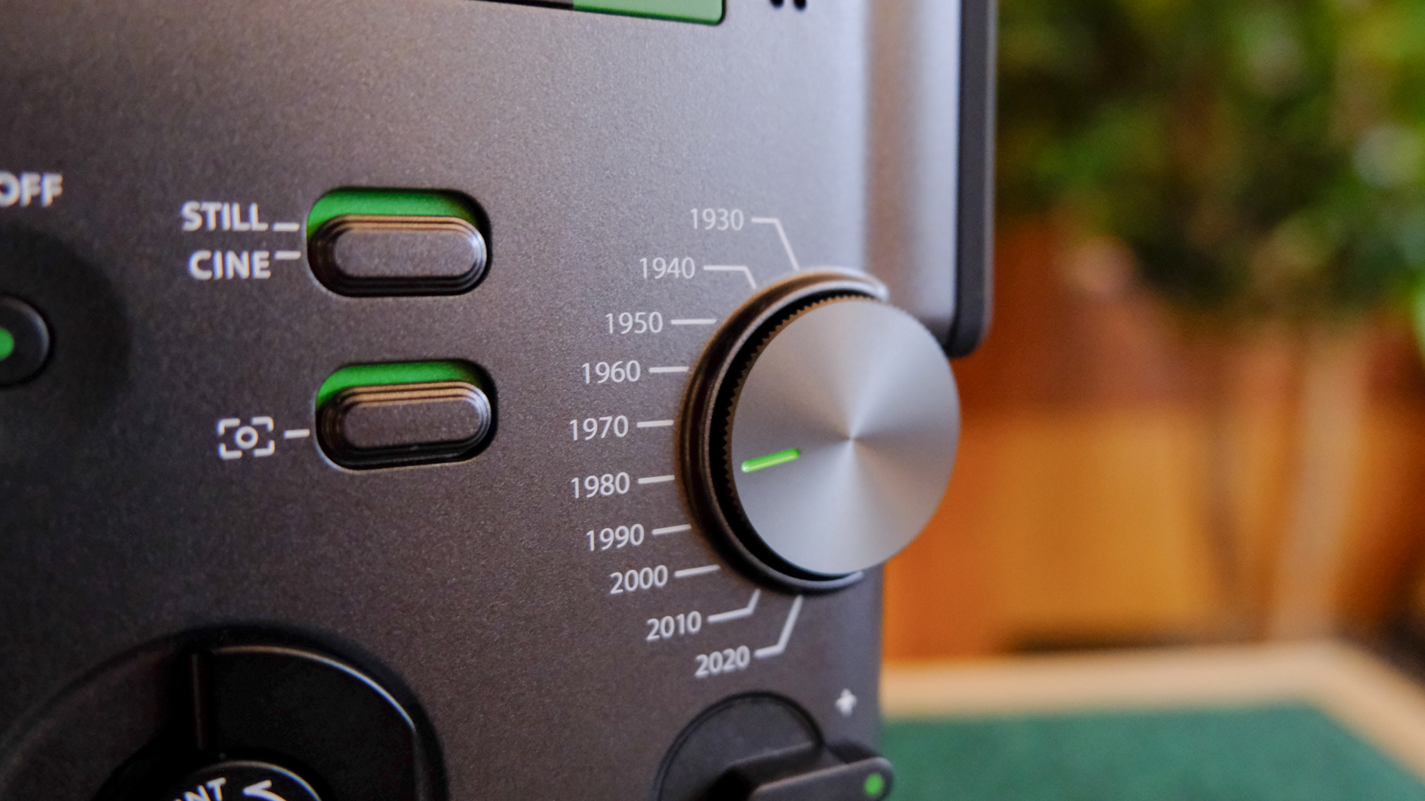 A black Fujifilm Instax mini Evo Cinema hybrid instant camera