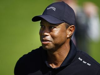 Tiger Woods in his Sun Day Red hat and shirt