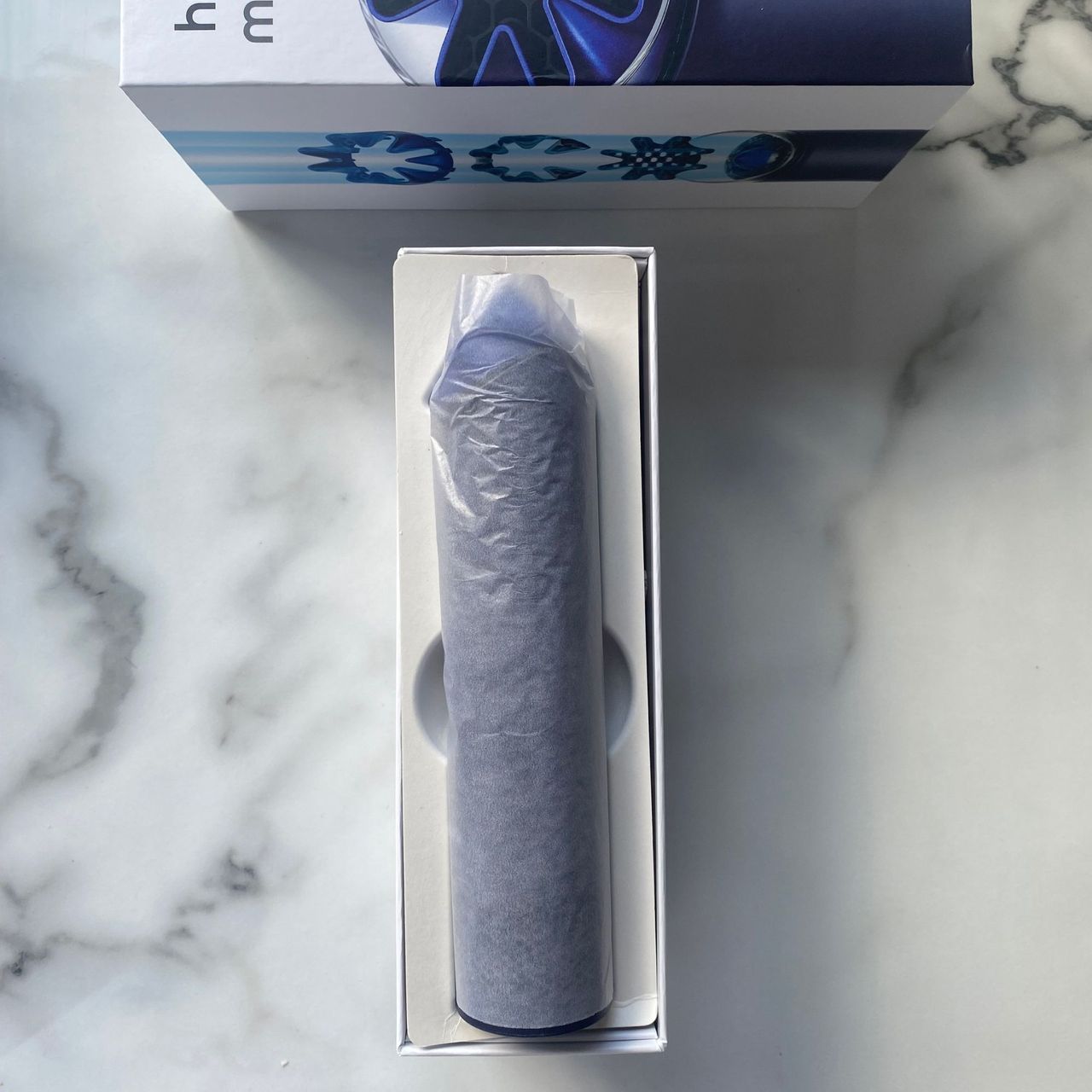 Internal packaging of the Dyson HushJet Mini Cool fan, on my marble look counter top