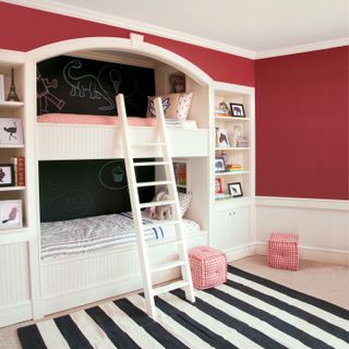 Kid's bunk beds with blackboard paint wall and red main walls