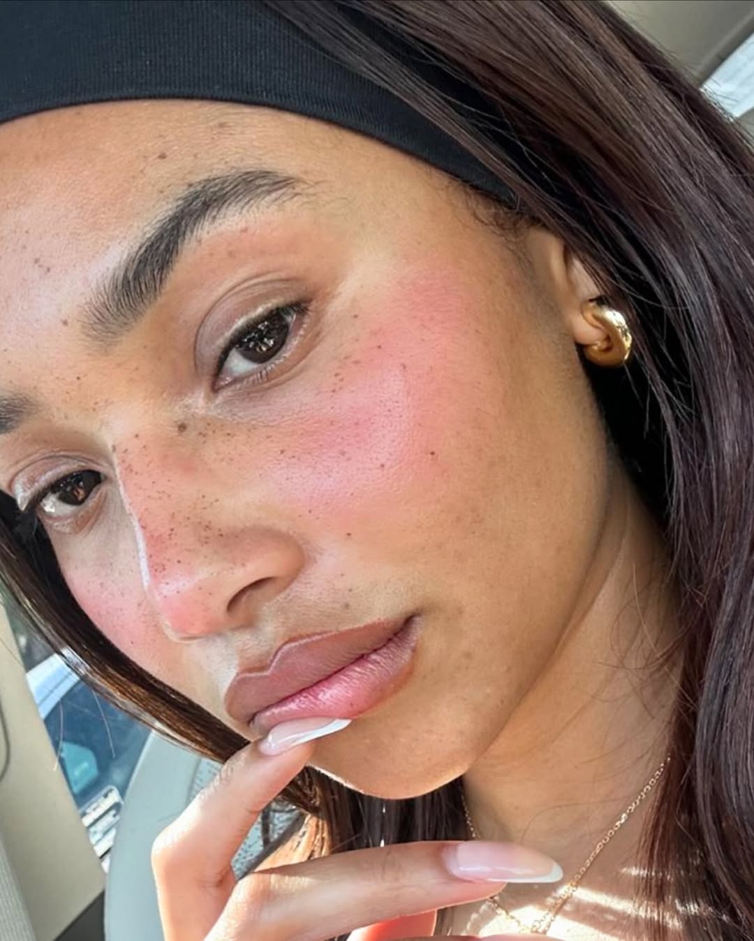 Fresh, dewy skin on content creator Symphani Soto