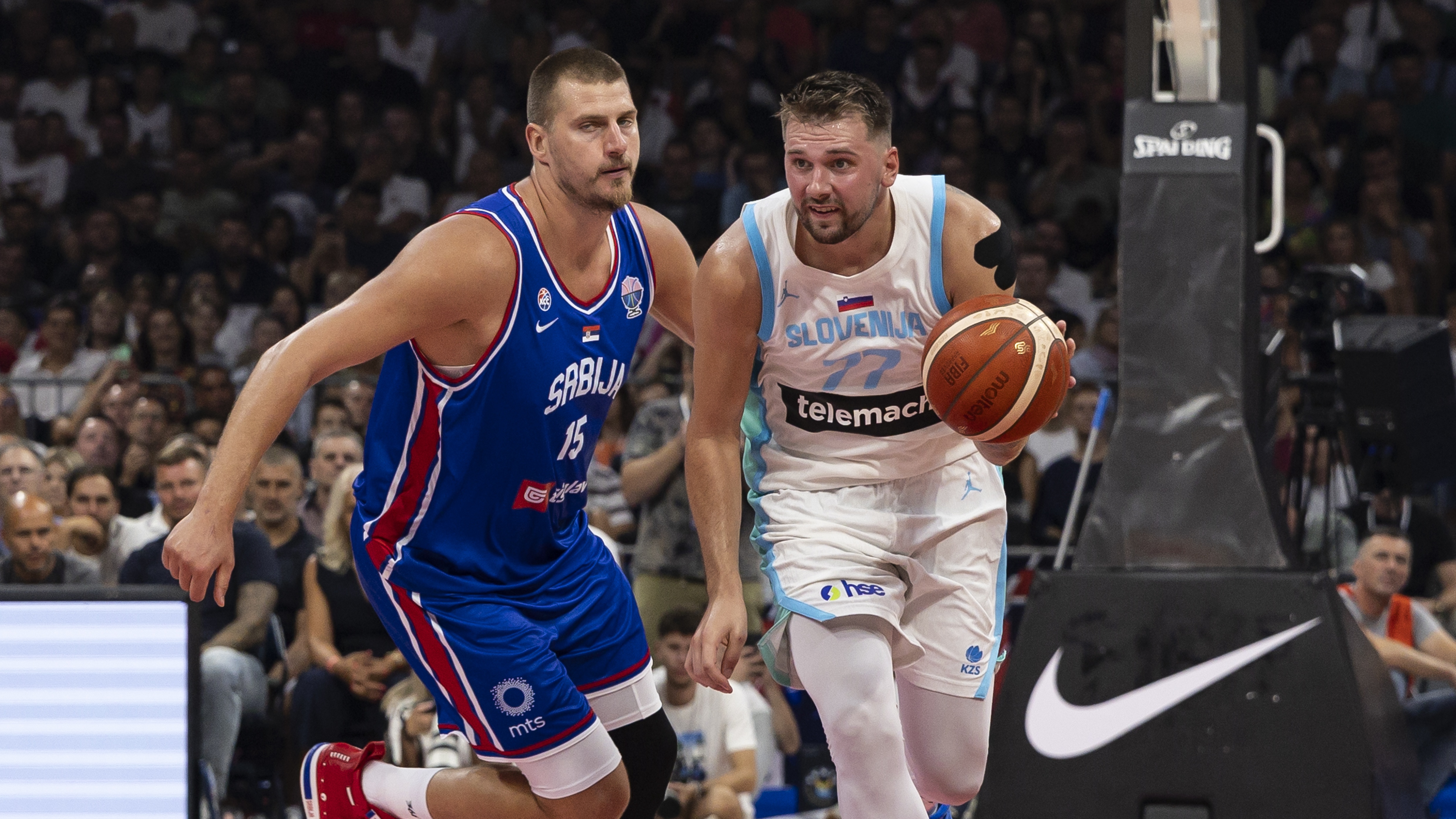 Luka Doncic (R) of Slovenia in action against Nikola Jokic of Serbia during the International Basketball Friendly match between Serbia and Slovenia at Belgrade Arena on August 21, 2025 in Belgrade, Serbia.