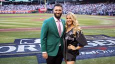 Masters champion Jon Rahm poses for a photo with his wife, Kelley Cahill, prior to Game 4 of the 2023 World Series between the Texas Rangers and the Arizona Diamondbacks at Chase Field on Tuesday, October 31, 2023