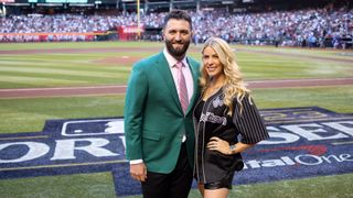 Masters champion Jon Rahm poses for a photo with his wife, Kelley Cahill, prior to Game 4 of the 2023 World Series between the Texas Rangers and the Arizona Diamondbacks at Chase Field on Tuesday, October 31, 2023