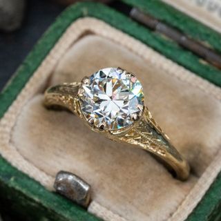 vintage engagement ring with circle diamond