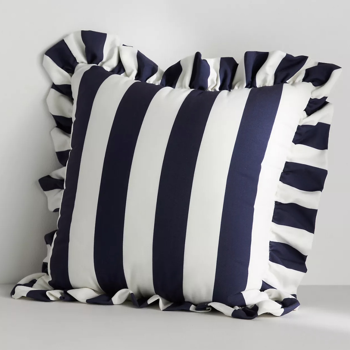 blue and white stripe pillow with ruffle edge