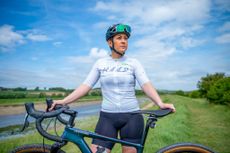 Rebecca Charlton stands behind her bike