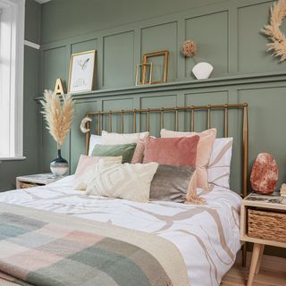 green bedroom with wall panelling