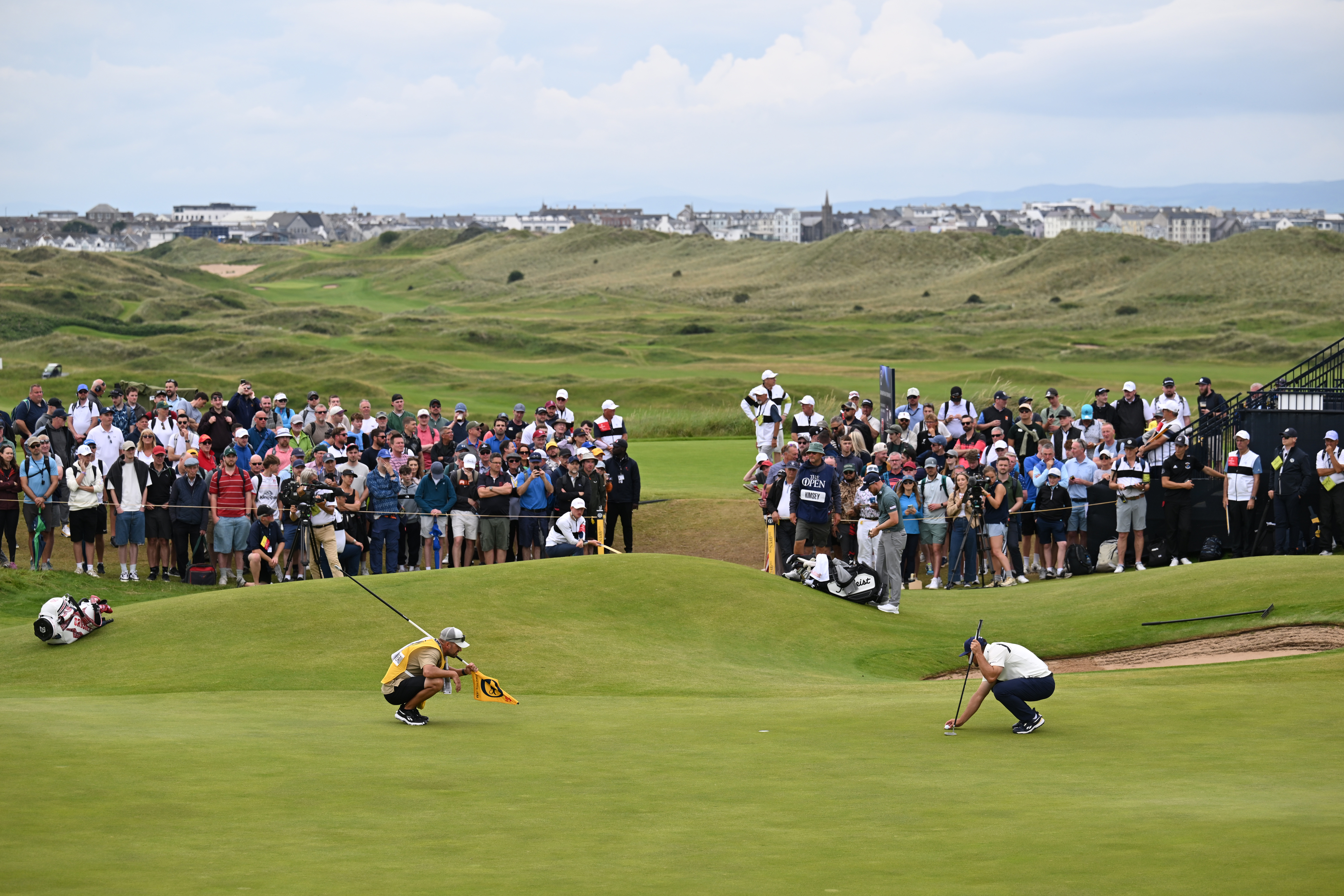Bryson DeChambeau lines up a putt