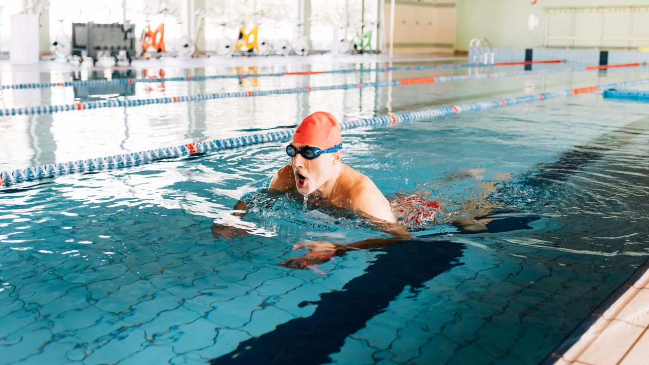 IS swimming good exercise? Image shows man in pool swimming