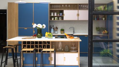 blue and pink modern handleless kitchen with island 