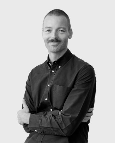 a man posing with his arms crossed
