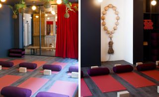 Yoga room with red yoga mats and purple cushions