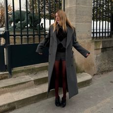 Camille Charriere wearing an argyle sweater.