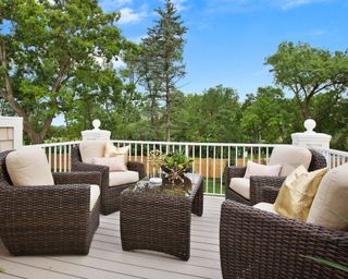 Synthetic wicker outdoor furniture set on deck