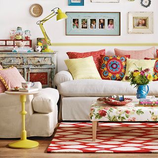colourful country living room with sofa cushions and coffee table