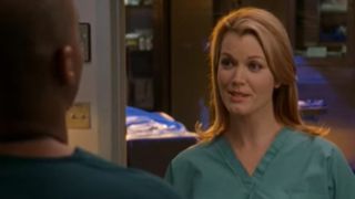 Bellamy Young talking to someone with his back to the camera on Scrubs