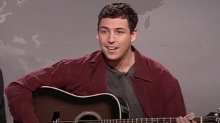 Adam Sandler playing guitar on Weekend Update.