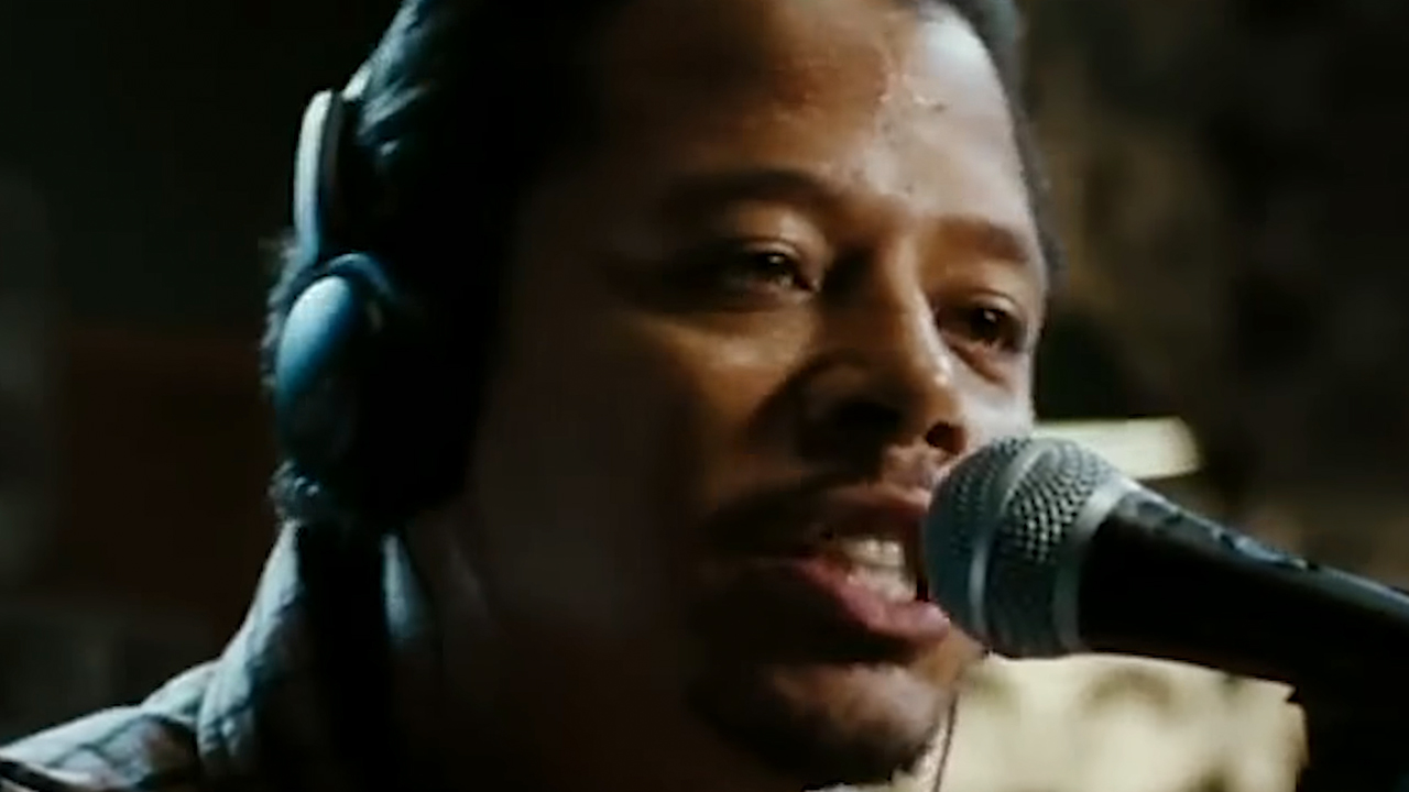 Terrence Howard speaking into a microphone in Hustle And Flow