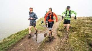 John Kelly running with teammates in the Peak District