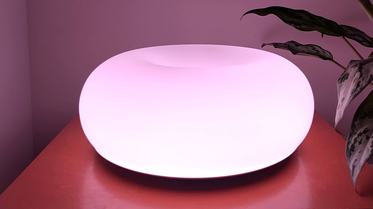 IKEA Varmblixt lamp illuminated pink on table