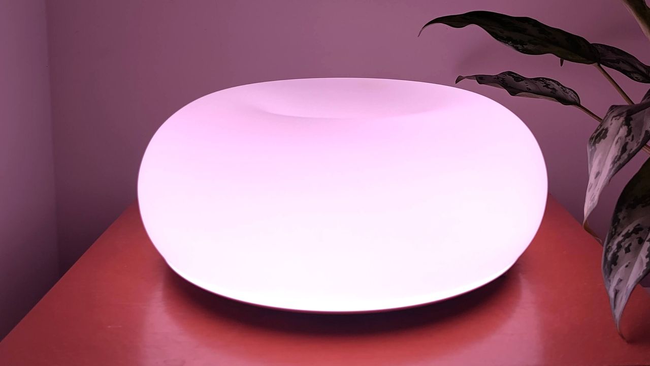 IKEA Varmblixt lamp illuminated pink on table