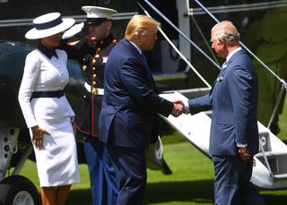 Donald Trump shaking hands with King Charles in 2019