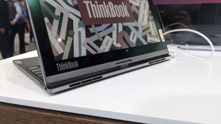 The Lenovo ThinkBook Plus Twist laptop on a display stand at the MWC 2023 event.