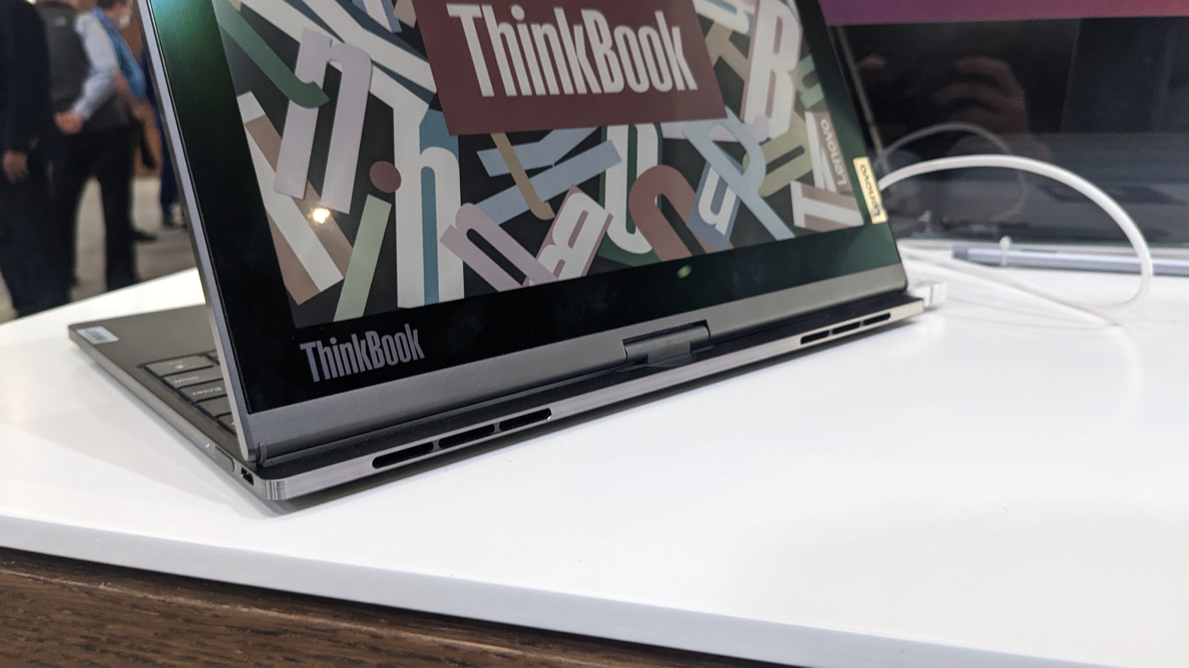 The Lenovo ThinkBook Plus Twist laptop on a display stand at the MWC 2023 event.