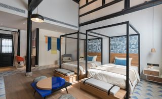 The bedroom of the Blossom Hill Qiu Shu Li hotel in Huzhou, China