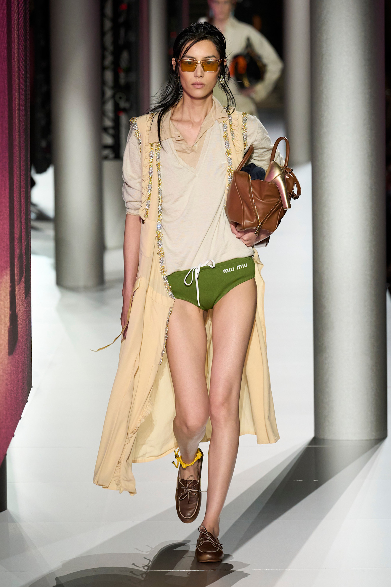 A model wore boat shoes on the Miu Miu Spring 2024 runway