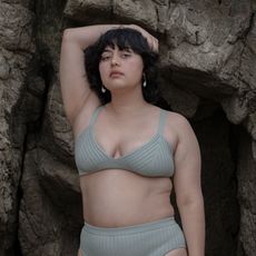 woman wearing sage colored knit bikini top