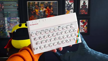 Hand holding The Spectrum White Edition.