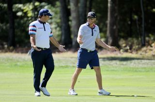 Patrick Reed and Talor Gooch chat walking down the fairway